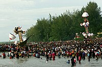 Tabuiks being lowered into the sea in Pariaman, Indonesia, by Shia Muslims