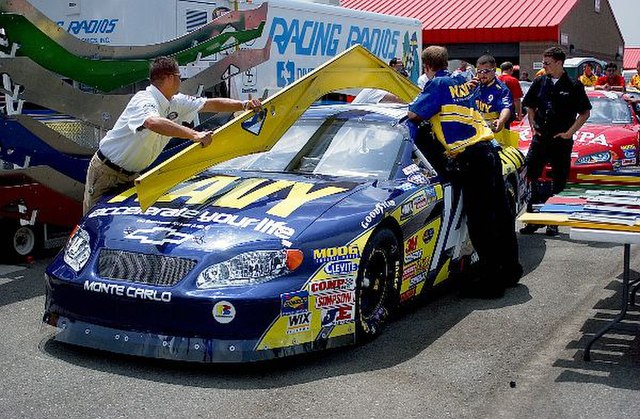 NASCAR officials use a template to inspect Casey Atwood's 2004 Busch Series Chevrolet Monte Carlo.