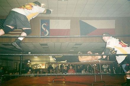The Public Enemy performing a double team maneuver with a table