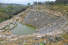 The theatre, erected in the Hellenistic period in the north slope of the south hill, its capacity was approximately 10,000 spectators, Caria, Turkey (20688140081).jpg