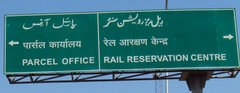 Urdu, Hindi, and English on a road sign in India