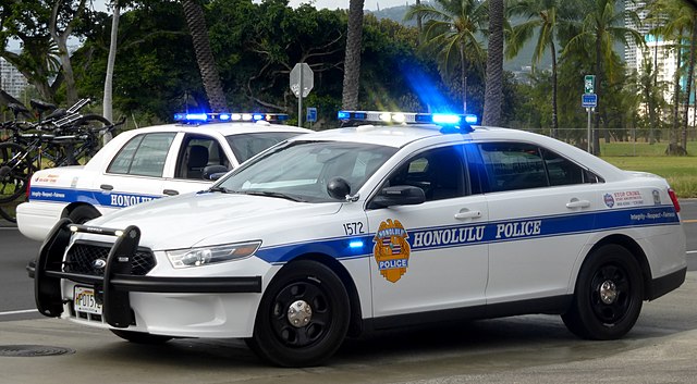 Two Honolulu Police Cars with their lights on, 2015