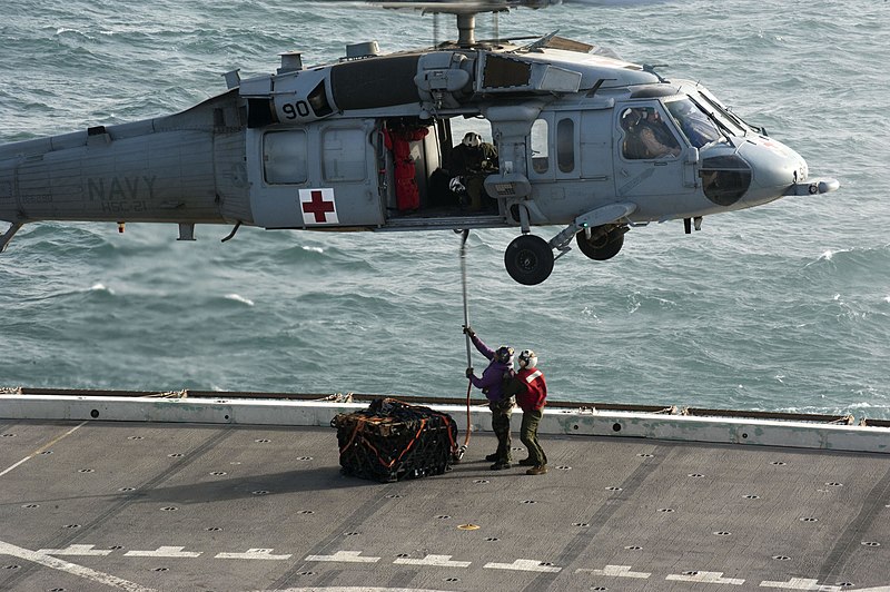 File:US Navy 120121-N-PB383-212 Sailors attach a cargo holder to an MH-60S Sea Hawk helicopter assigned to Helicopter Sea Combat Squadron (HSC) 21 on th.jpg