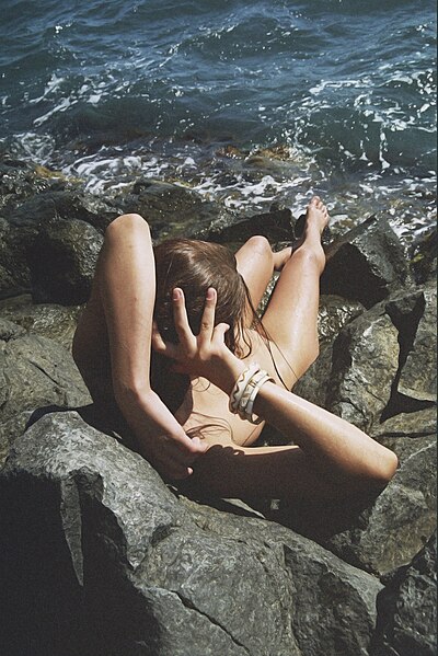 Wrightia nude on seaside rocks.jpg