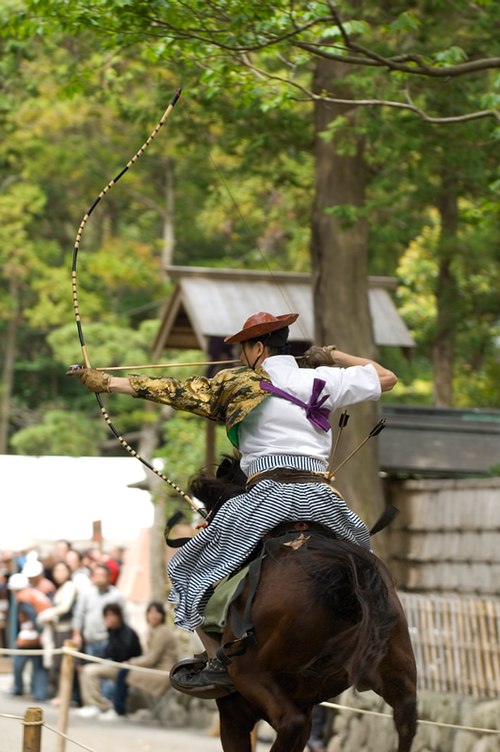 Yabusame archer takes aim on the second target.