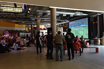 Employees watch the 2014 FIFA World Cup during a scheduled break