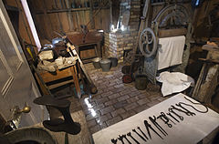 19th century toolshed with iron handtools, shoe repair bench, laundry press and other paraphernalia. Victorian Village, Museum of Transport and Technology (MOTAT) , Auckland, New Zealand.