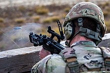 A United States National Guard soldier firing a 40 mm grenade from an M320 grenade launcher 211113-Z-IB607-1016 - M320 grenade launcher range (Image 6 of 16).jpg