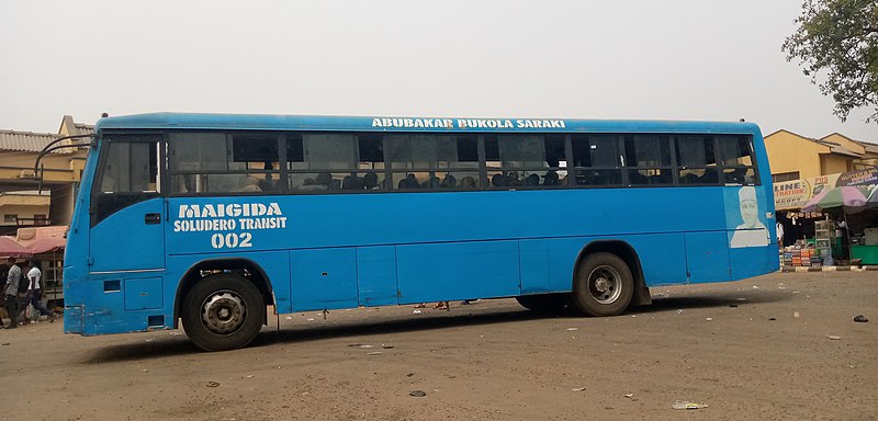 File:A bus loading passengers at its designated bus stop in the University of Ilorin, Ilorin car park 02.jpg