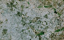 A satellite image from 2018. It is covered with the city area. Big lakes such as Bellandur are visible.