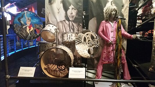 Aerosmith, Steven Tyler's outfit, Joey Kramer's drum-kit (1999) and drum heads - Rock and Roll Hall of Fame (2014-07-12 16.06.26 by Zurich 99).jpg