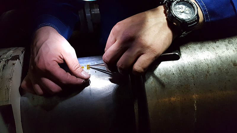 File:Almost like surgery – strain gauge installation on ship main shaft before tests; Gdansk University of Technology Faculty of Ocean Engineering and Ship Technology (Poland).jpg