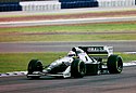Andrea de Cesaris - Sauber C13 at the 1994 British Grand Prix (32418704201).jpg