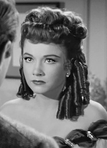Anne Baxter in wig and costume as Eve Harrington