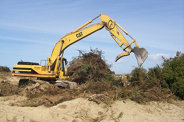 The hydraulic cylinders on this excavator operate the machine's linkages.