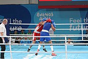 Deutsch: Boxen bei den Olympischen Jugendspielen 2018 Tag 12, 18. Oktober 2018 - Kampf um die Bronzemedaille im Fliegengewicht Mädchen – Timur Merjanow (Usbekistan, rot) schlägt Youssef Ali Karar Ali (Ägypten, blau) 5-0; Ringrichter ist Antonín Gaspar (Tschechien). English: Boxing at the 2018 Summer Youth Olympics on 18 October 2018 – Boy's heavyweight Bronze Medal Bout - Timur Merjanov (Uzbekistan, red) beats Youssef Ali Karar Ali (Egypt, blue) 5-0; Referee is Antonín Gaspar (Czech Republic). Español: Boxeo en los Juegos Olímpicos Juveniles de Verano de 2018 en 18 de octubre de 2018 - Medalla de bronce de peso pesado del muchacho: Timur Merjanov (Uzbekistán, roja) le gana a Youssef Ali Karar Ali (Egipto, azul) 5-0; El árbitro es Antonín Gaspar (Republica checa).