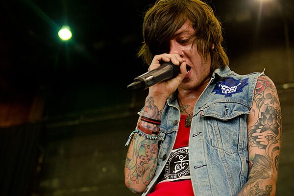 Schmitt performing with Breathe Carolina on Warped Tour 2012