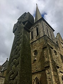 The church tower and Celtic cross