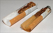 Filters in a new and used cigarette. Filters were designed to turn brown with use to give the illusion that they were effective at reducing the harmfulness. Cigarettefiltar.jpg