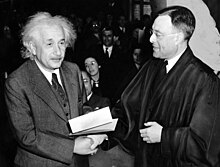 Einstein accepting US citizenship certificate from judge Phillip Forman Citizen-Einstein.jpg