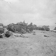 AVRE on the Normandy beach during the D-Day landings D-day - British Forces during the Invasion of Normandy 6 June 1944 B5095.jpg