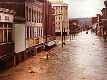 View from Erie Lackawanna train tracks, looking down Water Street during the Flood of 1972. The Elmira Savings and Loan bank building can be seen in the background.