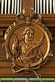 Medaillon van Sint Apollonia bij het orgel