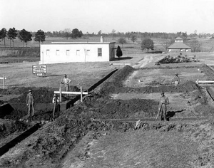 Dining hall construction with "White House" in background, 1936 FlaIndusSchBoys pr24642.png