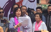 Ousted Chief Justice Maria Lourdes Sereno (left) addresses her crowd of supporters after her peers in the Supreme Court voted to oust her based on the solicitor general's quo warranto petition on May 11, 2018 Former CJ Sereno.jpg