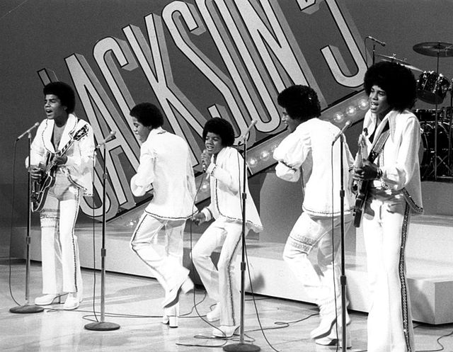 Michael Jackson (center) as a member of the Jackson 5 in 1972. The group were among the first African American performers to attain a crossover follow