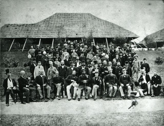 Hawaiian King Kalakaua visits Hong Kong in 1881. Hennessy is sitting immediately to the left of the King