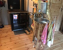 A kitchen sink stand made from hollowed out log for an off grid home Log furniture kitchen sink stand made from hollowed out log.jpg