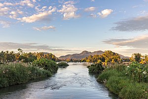 Mekong river surrounded by rainforest and mountains