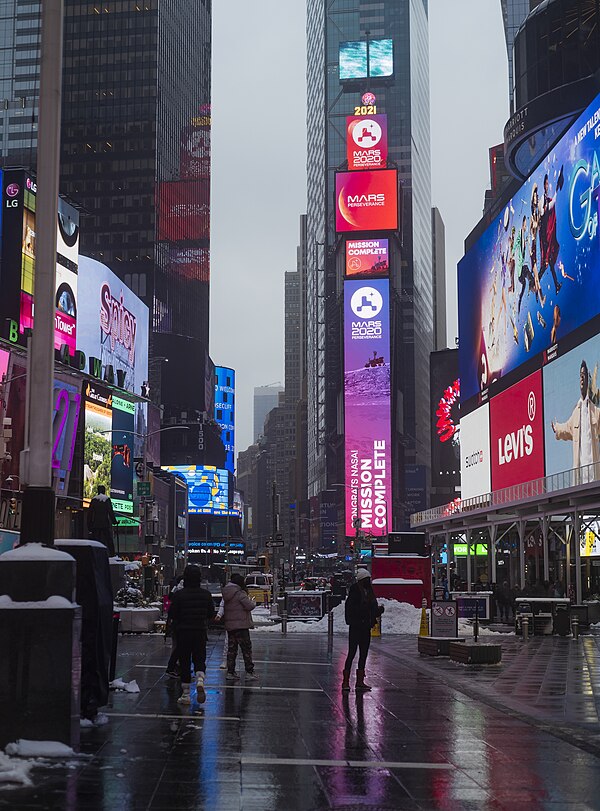 One Times Square in 2021, with a display commemorating the landing of NASA's Perseverance rover. The building is barely visible given the signage.