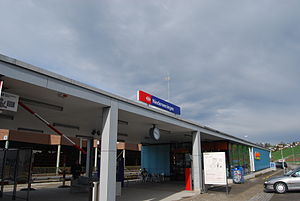 Single-story building with flat roof and canopy