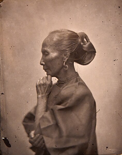 Chinese woman with an elaborate hair style, 1869