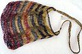 A bilum bag, used in Papua New Guinea. Bilums are made of "bush rope", cuscus fur or wool, and expand in size