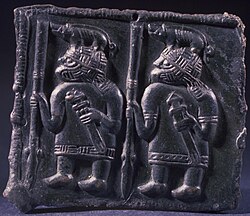 Warriors wearing boar-crested helmets on a Torslunda plate, dated to between the 6th and 8th century CE. Patris Torslundaplatarna - Historiska museet - 108869 HST (cropped).jpg