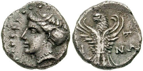 Ancient Greek coin from Sinope, coast depicting the head of a nymph and an eagle with raised wings, 4th Century BC