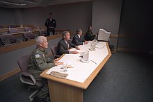 Richard Mies, President George Bush and White House Chief of Staff Andrew Card participate in a video teleconference from Offutt Air Force Base in Nebraska on September 11, 2001. President George W. Bush Teleconference at Offutt Air Force Base.jpg