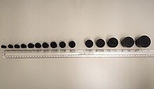 (From left to right) Rubber bungs are aligned from size no. 1, 2, 3, 4, 6, 7, 8, 9, 10, 12, 13, 14, 15, to 16, respectively. (Comparing to the ruler) Rubber stopper size.jpg