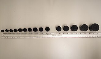 (From left to right) Rubber bungs are aligned from size no. 1, 2, 3, 4, 6, 7, 8, 9, 10, 12, 13, 14, 15, to 16, respectively. (Comparing to the ruler) Rubber stopper size.jpg