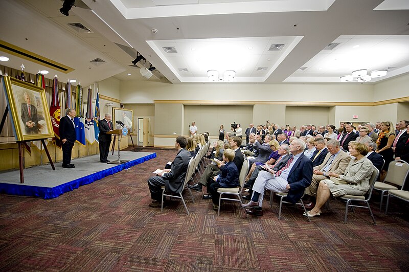 File:Secretary of Defense Robert M. Gates, second from left, addresses the audience while former Secretary of Defense Donald H. Rumsfeld, left, looks on during Rumsfeld's portrait unveiling ceremony at the Pentagon 100625-D-JB366-013.jpg