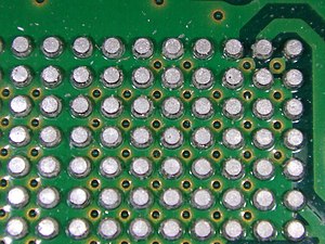 A grid array of solder balls on a printed circuit board after removal of an integrated circuit chip. Solder ball grid.jpg