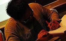 Vic Nierva signing a copy of 'Antisipasyon' TheAuthor.jpg