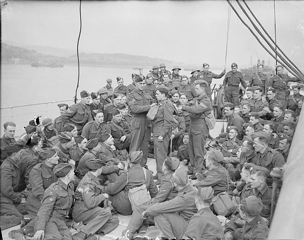 Some members of the 1/6th Battalion, Duke of Wellington's Regiment testing gas equipment on board the Polish liner MS Sobieski, April 1940. She was ly