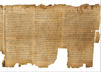 A long, tattered piece of old parchment with Hebrew writing.