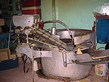 A tortilla machine inside a tortilleria Tortilla machine.jpg