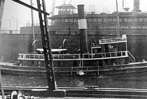 Tug Jack T. Scully, later USS Mariner (SP-1136), of the Neptune Line pictured in front of a Pennsylvania Railroad ferry, c. 1917. Mariner sank during a gale in the North Atlantic on 26 February 1918.