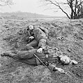 Two young German soldiers, one injured, the other dead. As they advanced into Germany, the Allied soldiers were constantly surprised at the extreme youth of the enemy forces. 24 - 31 March 1945